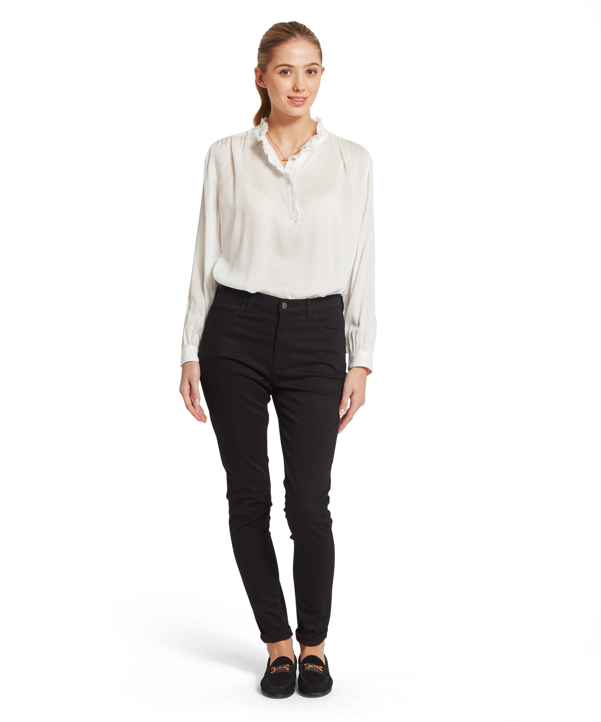 Schöffel Women's Chelsworth Blouse in white, full-length front view with relaxed silhouette, ruffle-neck detail, billowy sleeves with cuffed wrists, styled with slim black trousers and suede loafers
