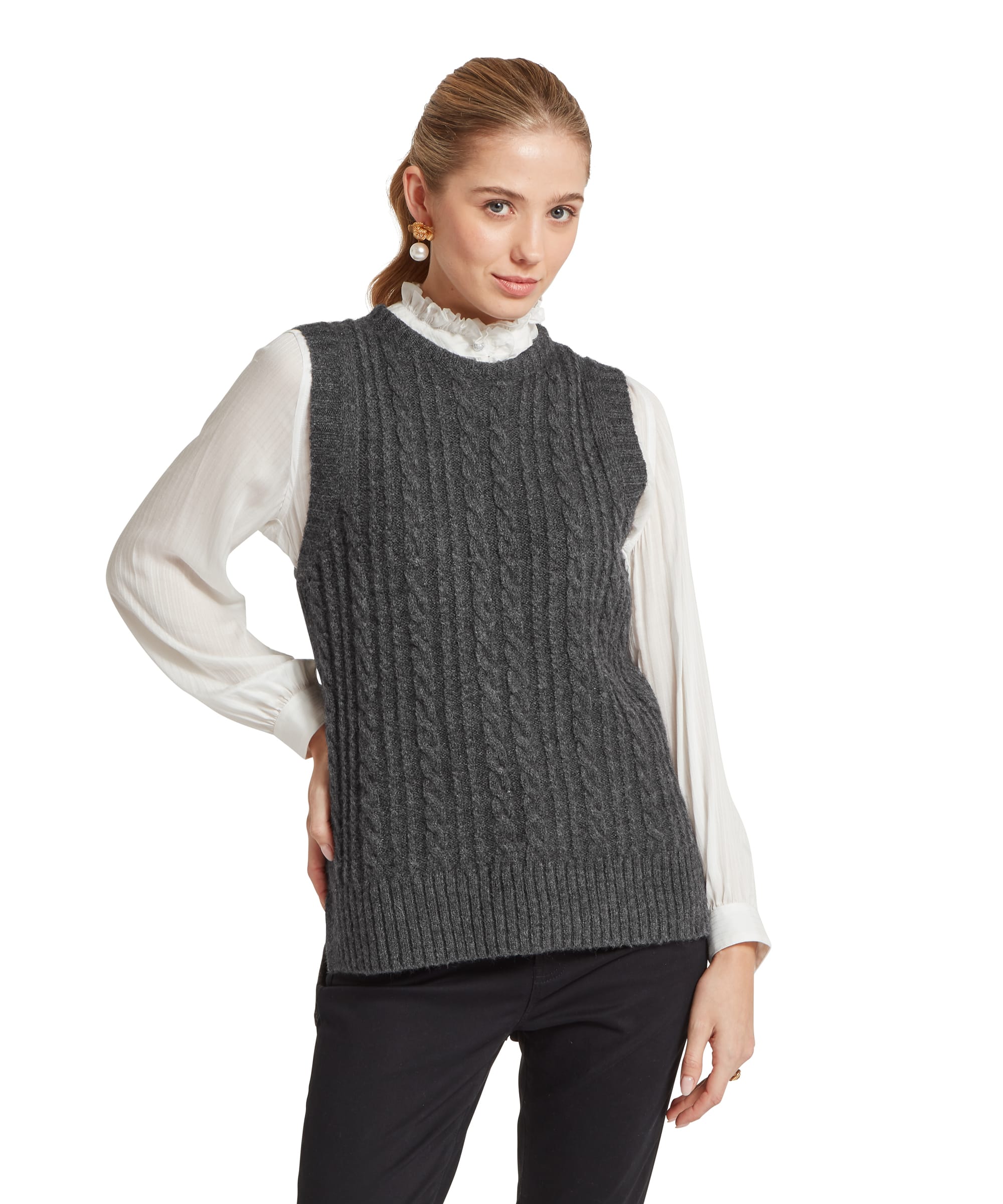 Schöffel Women's Evie Sleeveless Jumper in charcoal grey, front view showing cable-knit pattern and round neckline, styled over a white ruffled collar blouse with black trousers and pearl earrings