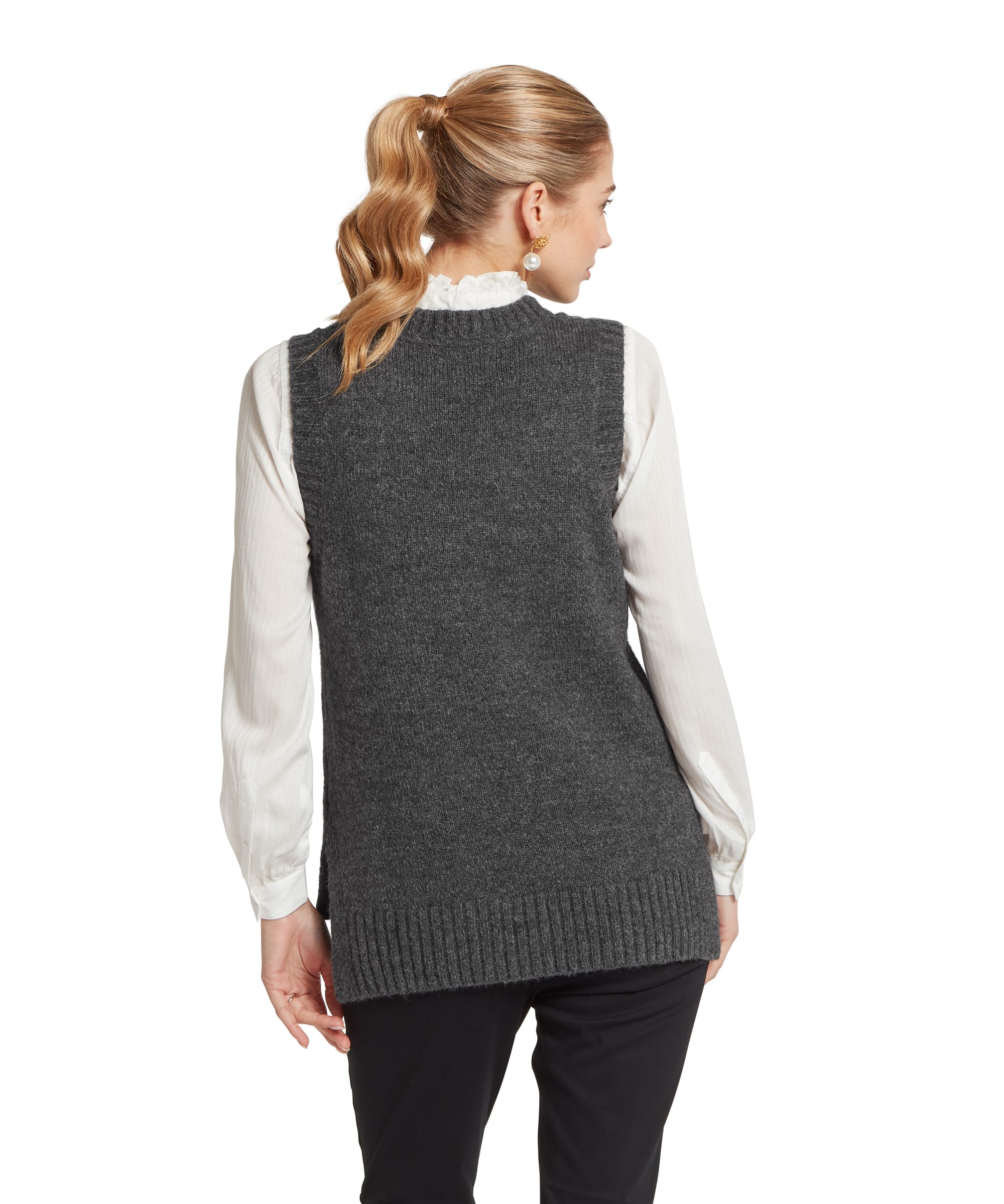 Back view of the Schöffel Women's Evie Sleeveless Cable Knit Jumper in Charcoal, showing the smooth reverse knit back, armhole construction and ribbed hem, layered over a white shirt and black trousers