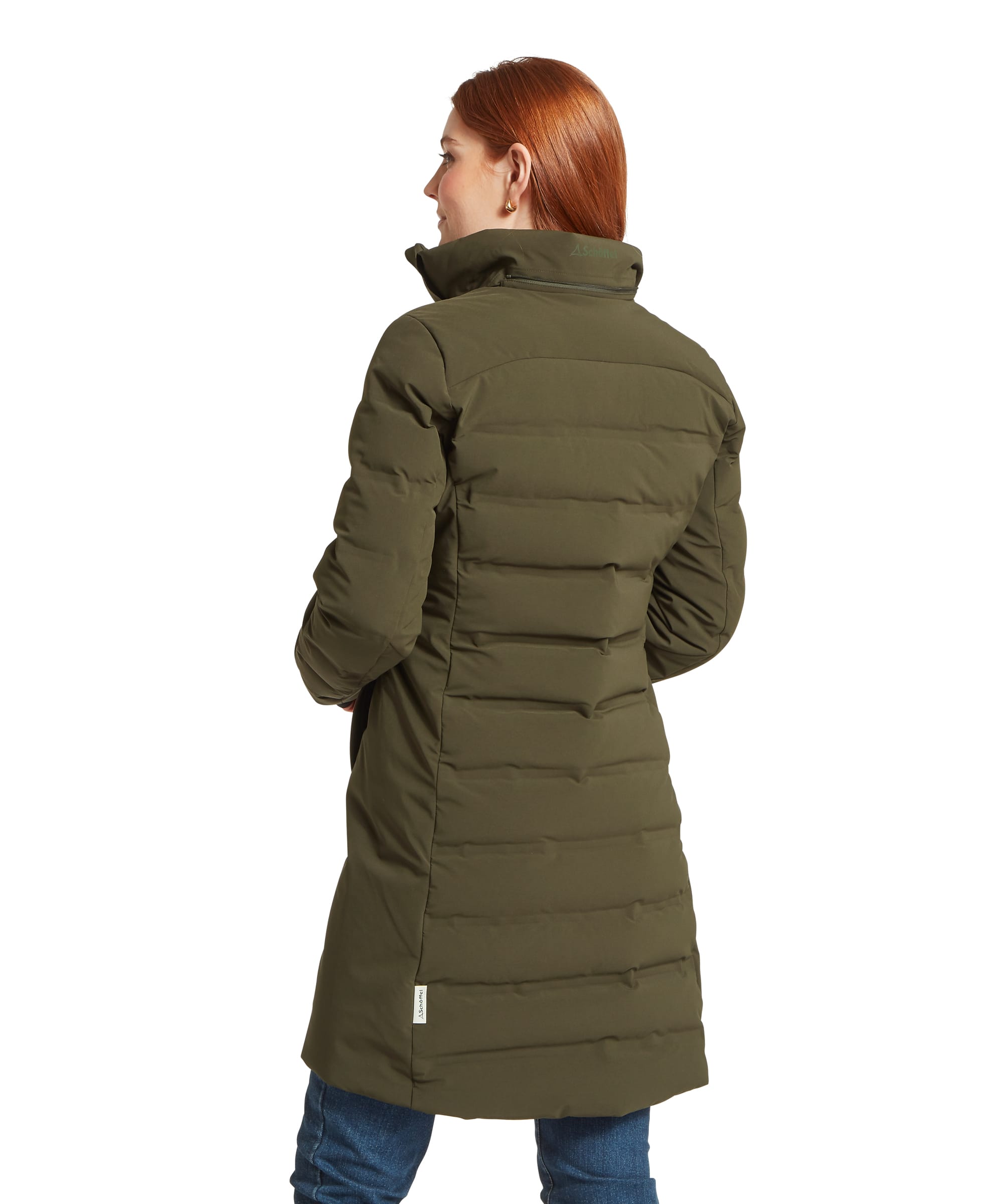 Rear view of the Women's Schöffel Hurlingham Waterproof Down Coat in dark olive green, showing the horizontal quilted baffles, fold-away hood collar, mid-length silhouette and Schöffel woven label at the hem, styled with blue jeans.