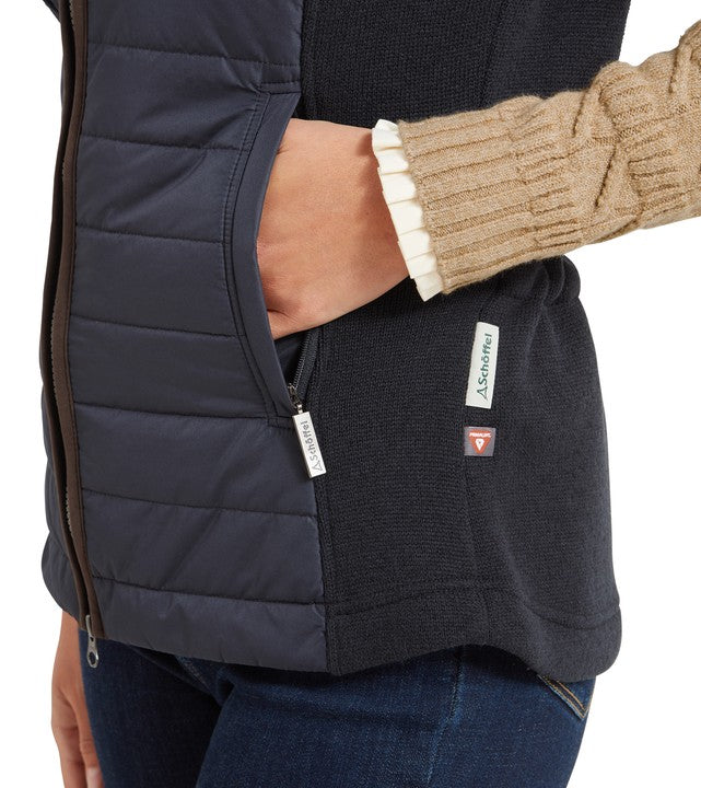 Side view of the Schöffel Women's Lyndon Hybrid Gilet in navy showing the zip pocket detail