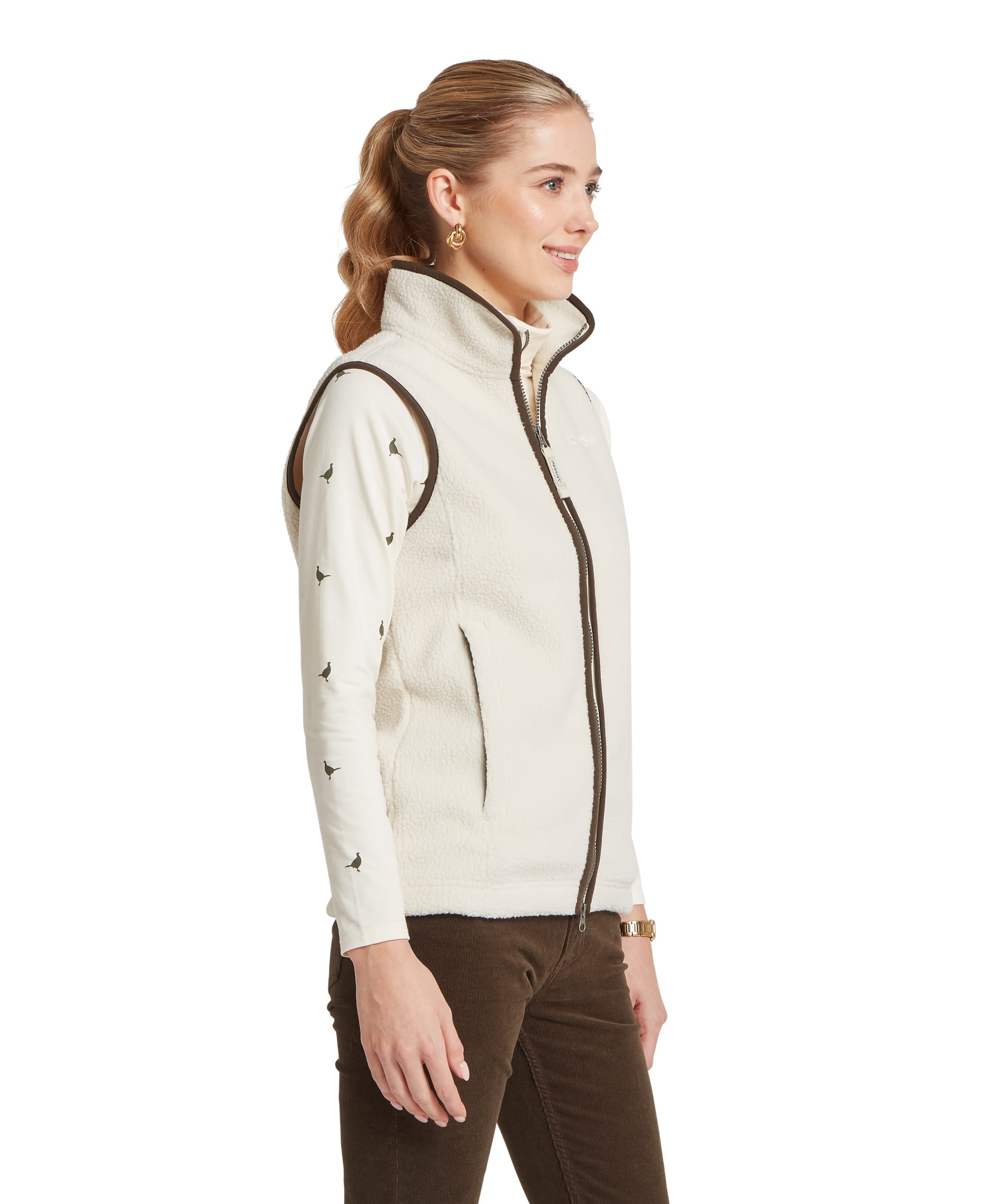 Schöffel Women's Lyndon Retro Fleece Gilet in Cream — side view showing full-zip, dark khaki trim and layered over pheasant-print base layer