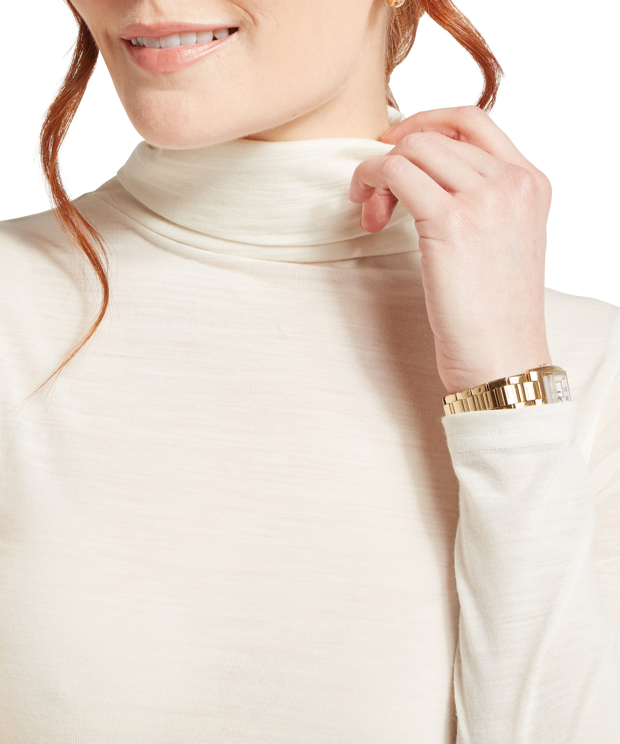 Close-up of the roll neck collar on the Schöffel Women's Malton Merino Top in White, highlighting the soft merino fabric texture and neat fold of the neck, shown with a gold watch at the wrist