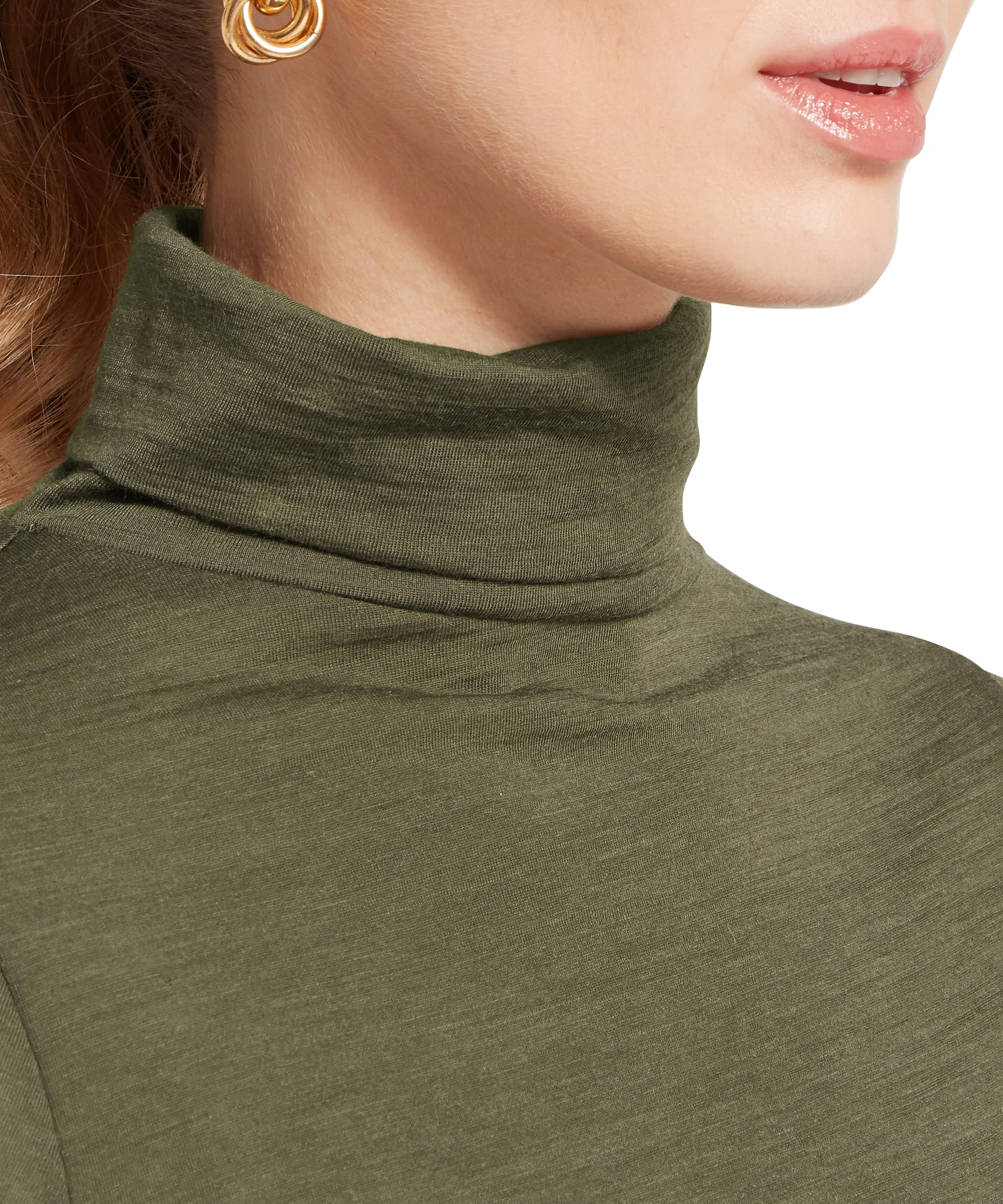 Close-up of the roll neck collar on the Schöffel Women's Malton Merino Top in Khaki Green, highlighting the soft merino fabric texture and elegant fold of the neck