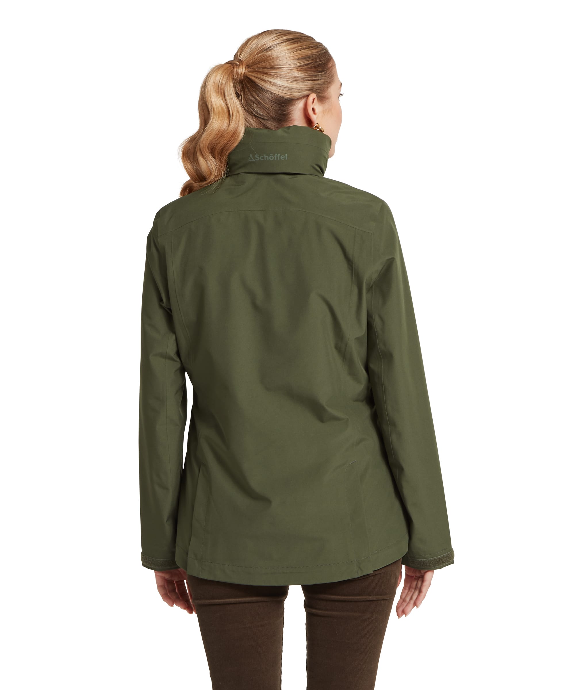 Back view of the Schöffel Women's Manton Lightweight Waterproof Jacket in Dark Olive, showing the Schöffel branding at the collar, clean back seam construction and shaped hem, worn over dark cord trousers