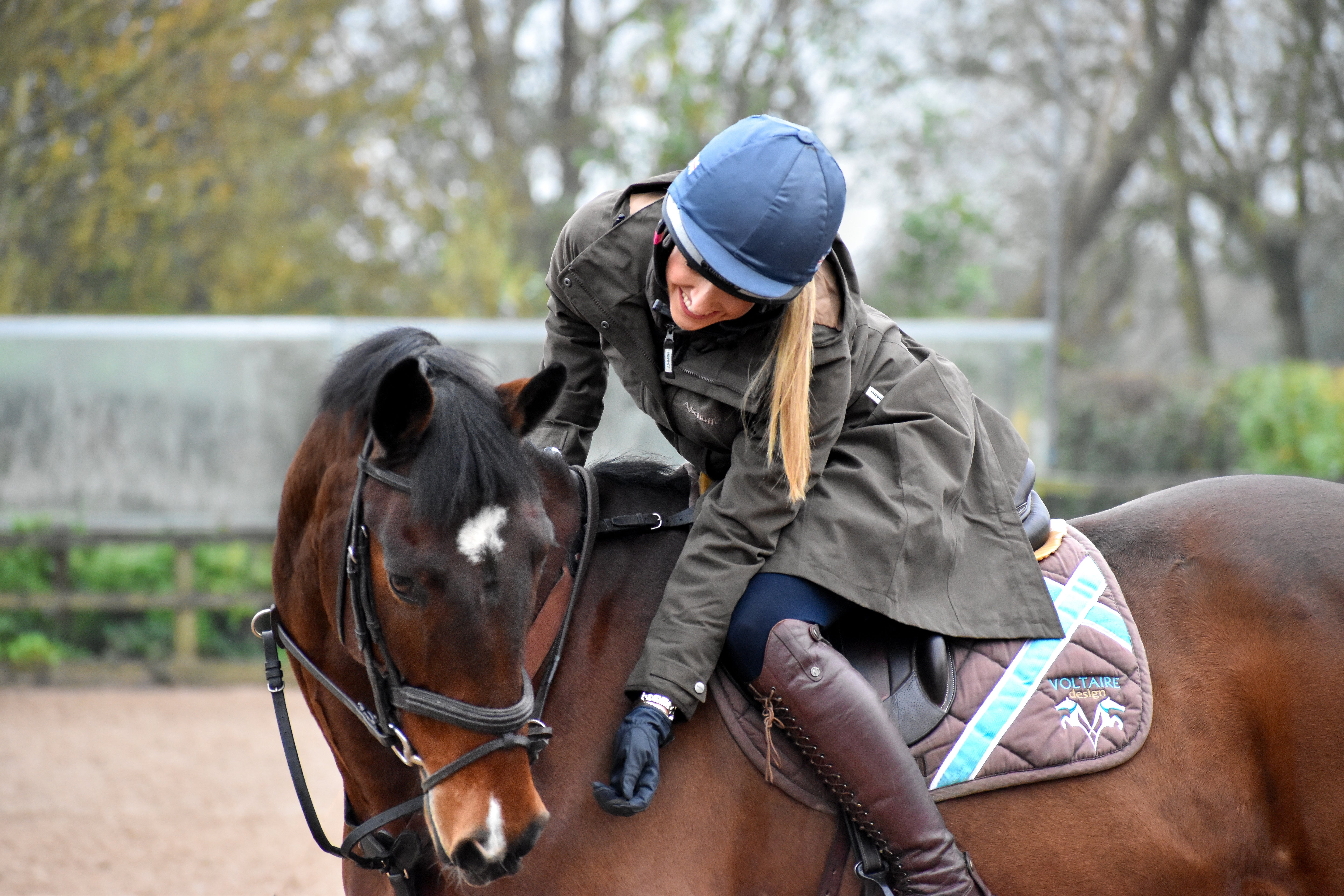 Lady on a horse wearing Marefield coat