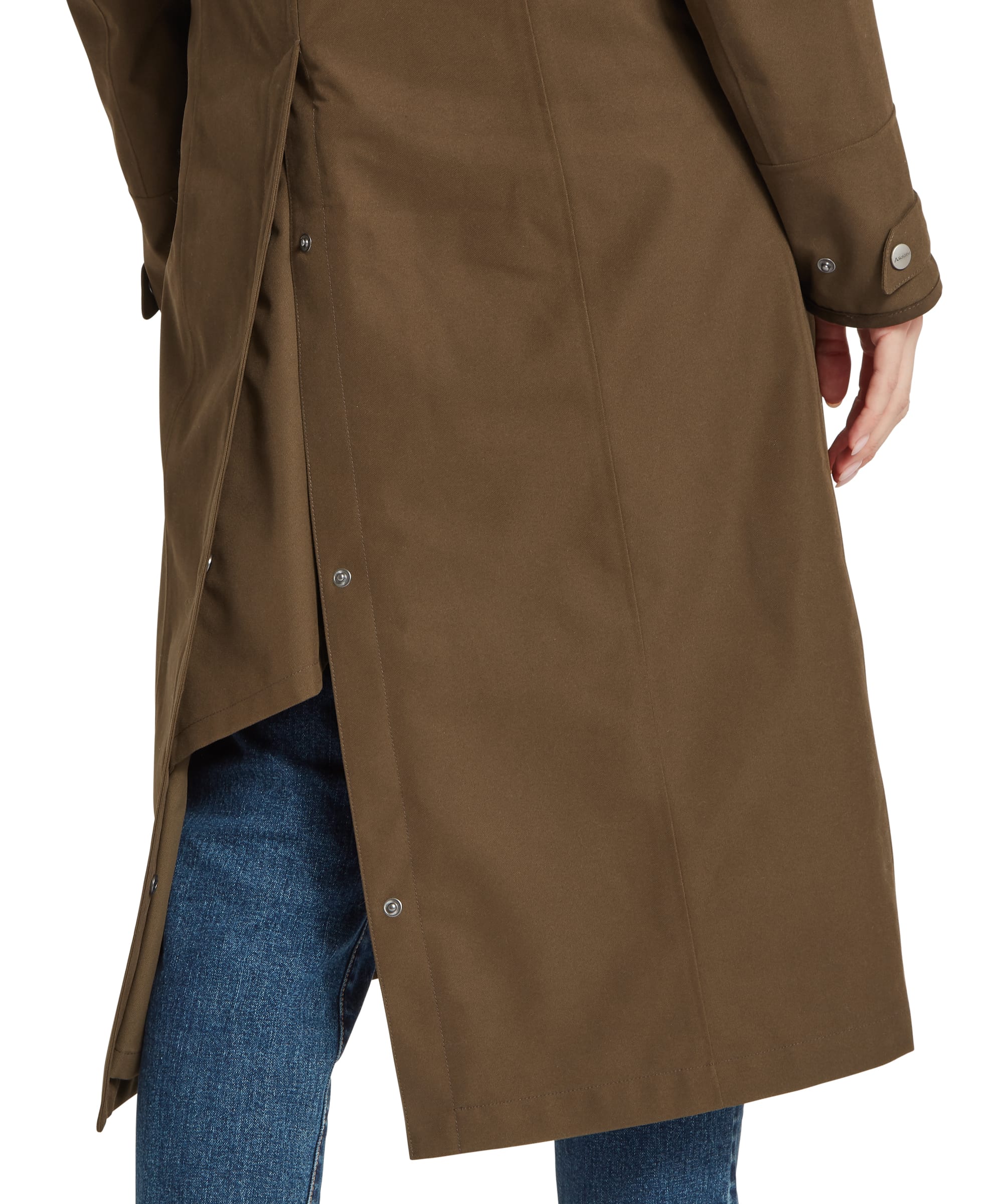 Back hem detail of the Schöffel Women's Marefield Waterproof Coat in khaki green, showing the kickpleat vent with press-stud adjusters, side seam, and cuffed sleeve with snap fastening for ease of movement on the moor