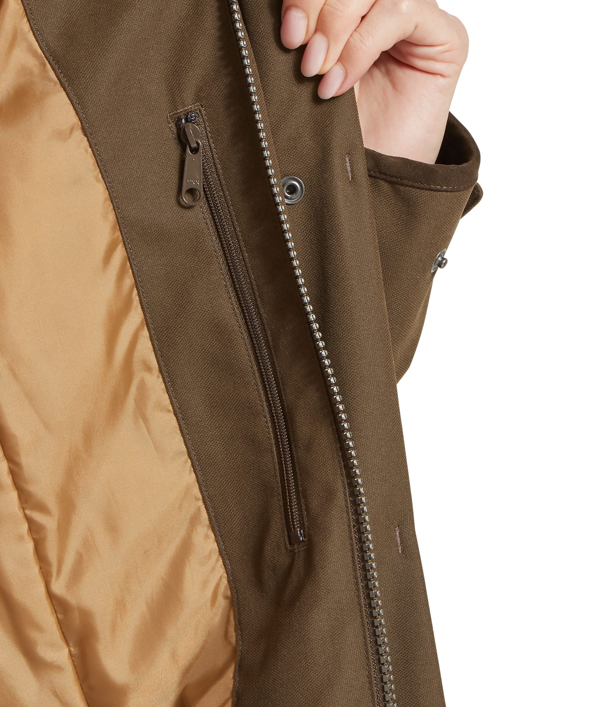 Interior pocket detail of the Schöffel Women's Marefield Waterproof Coat in khaki green, showing the inner zip pocket, YKK main zip, and warm quilted lining with tan taffeta insulation visible on the inside