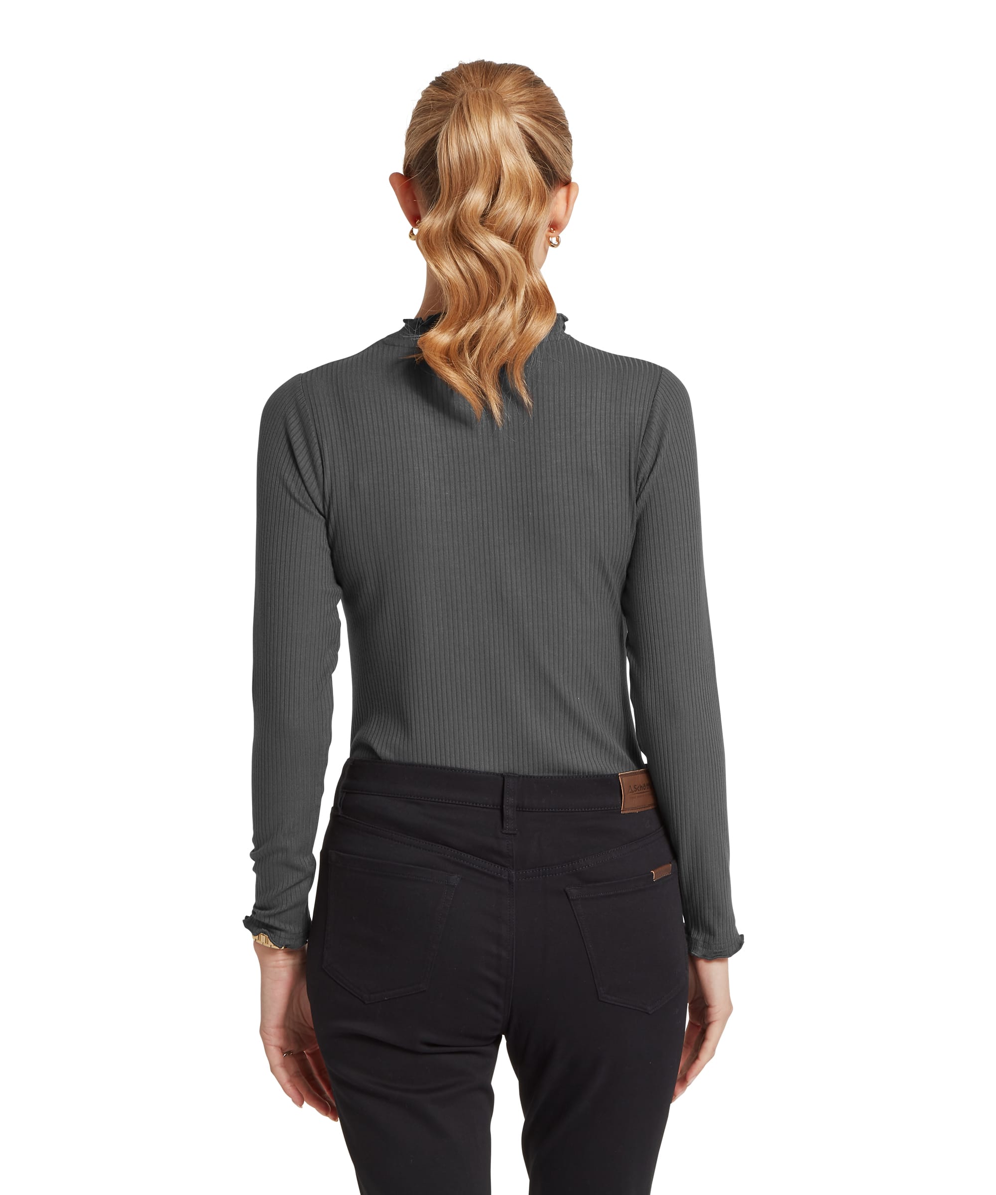 Rear view of the Women's Schöffel Roseberry Top in charcoal grey rib, showing the clean back and frilled mock neck detail, worn with slim black trousers and a Schöffel branded leather tab visible at the waistband.
