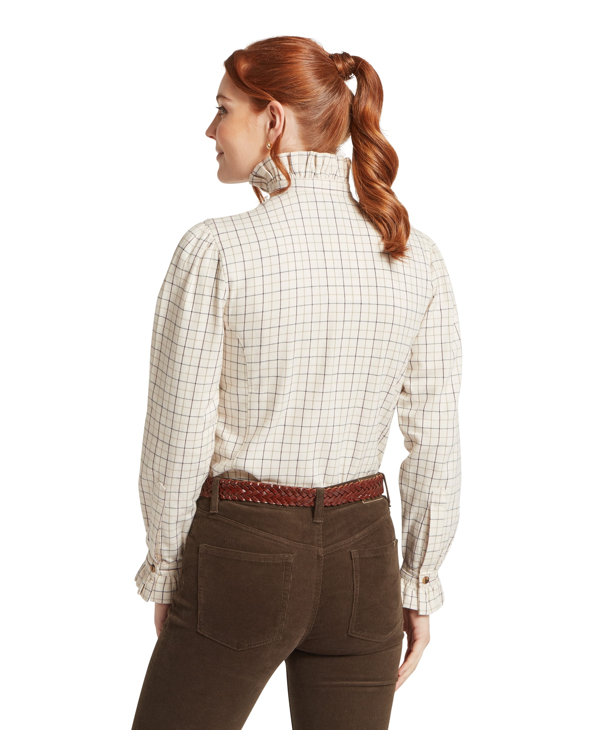 Schöffel Women's Sheringham Shirt in cream windowpane check, rear view showing the ruffle stand collar, puff sleeves with elasticated cuffs and fitted body, worn with chocolate brown cord trousers and a tan plaited leather belt
