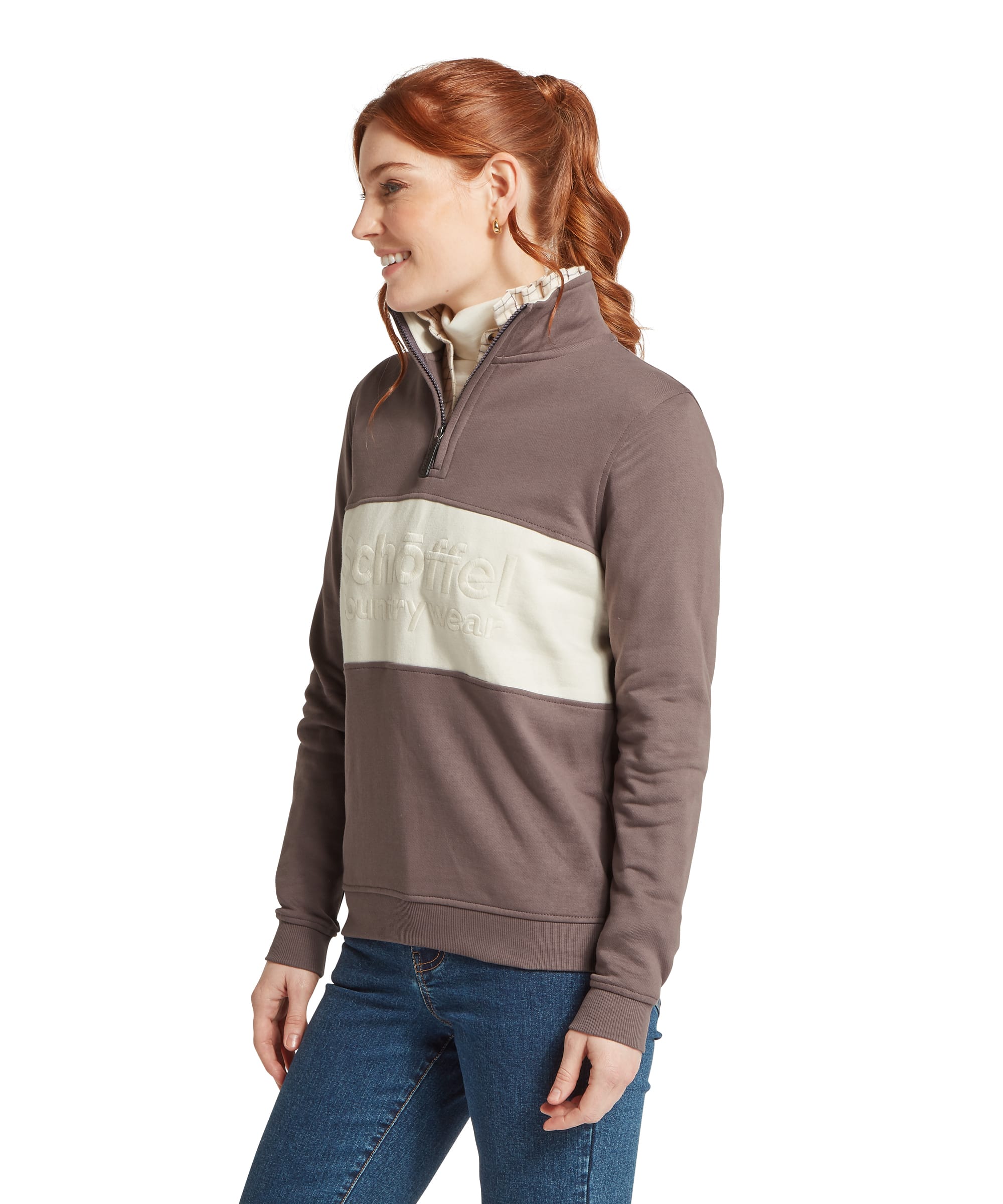 Schöffel Women's St Agnes Sweatshirt in Taupe — side profile of quarter-zip sweatshirt with colour-block panel and embossed Schöffel Country Wear branding, styled with jeans