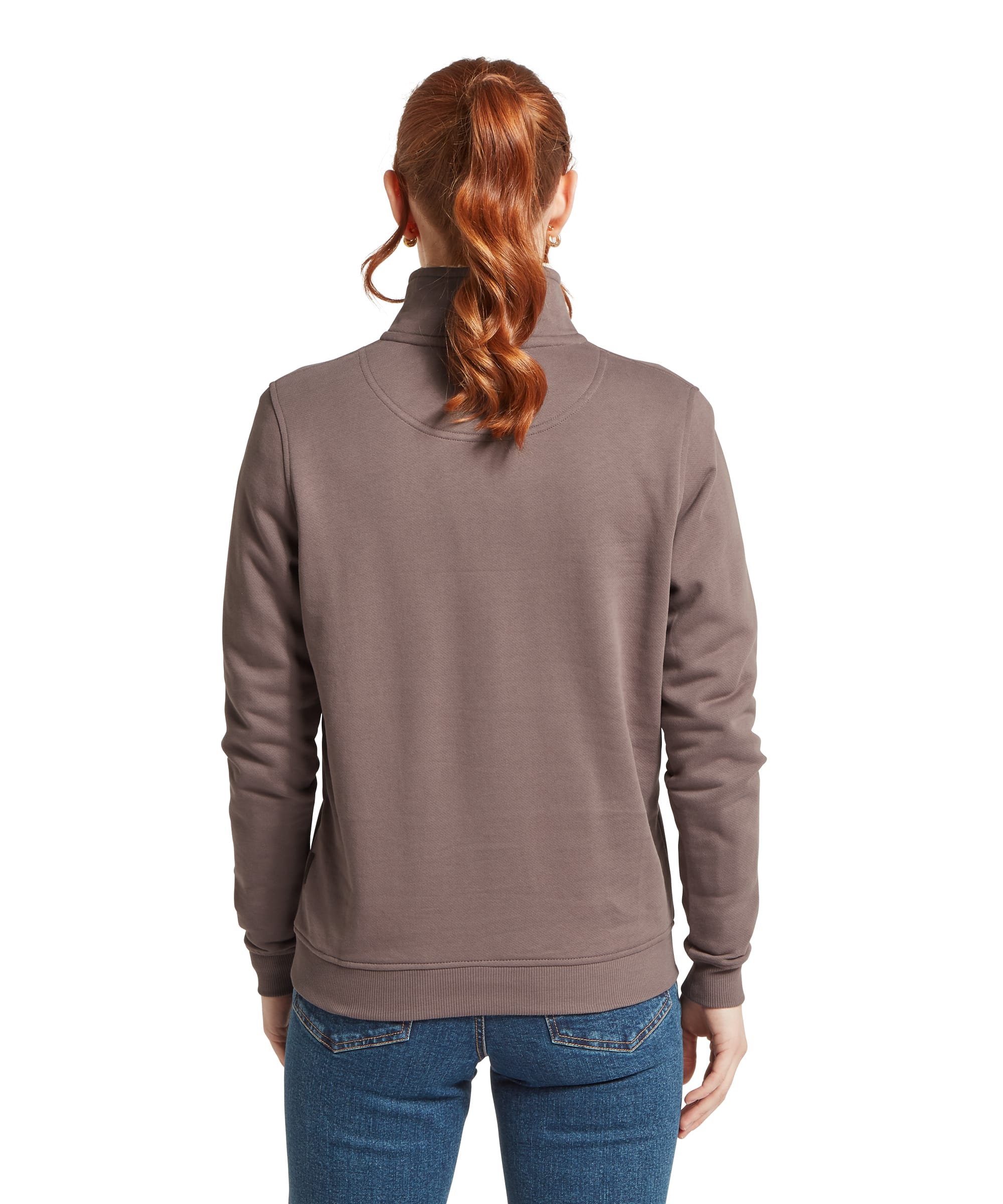 Schöffel Women's St Agnes Sweatshirt in warm taupe brown, rear view showing the plain jersey back panel, stand collar, curved back yoke seam, ribbed hem, and tonal Schöffel embroidered logo at the upper back, worn with blue jeans