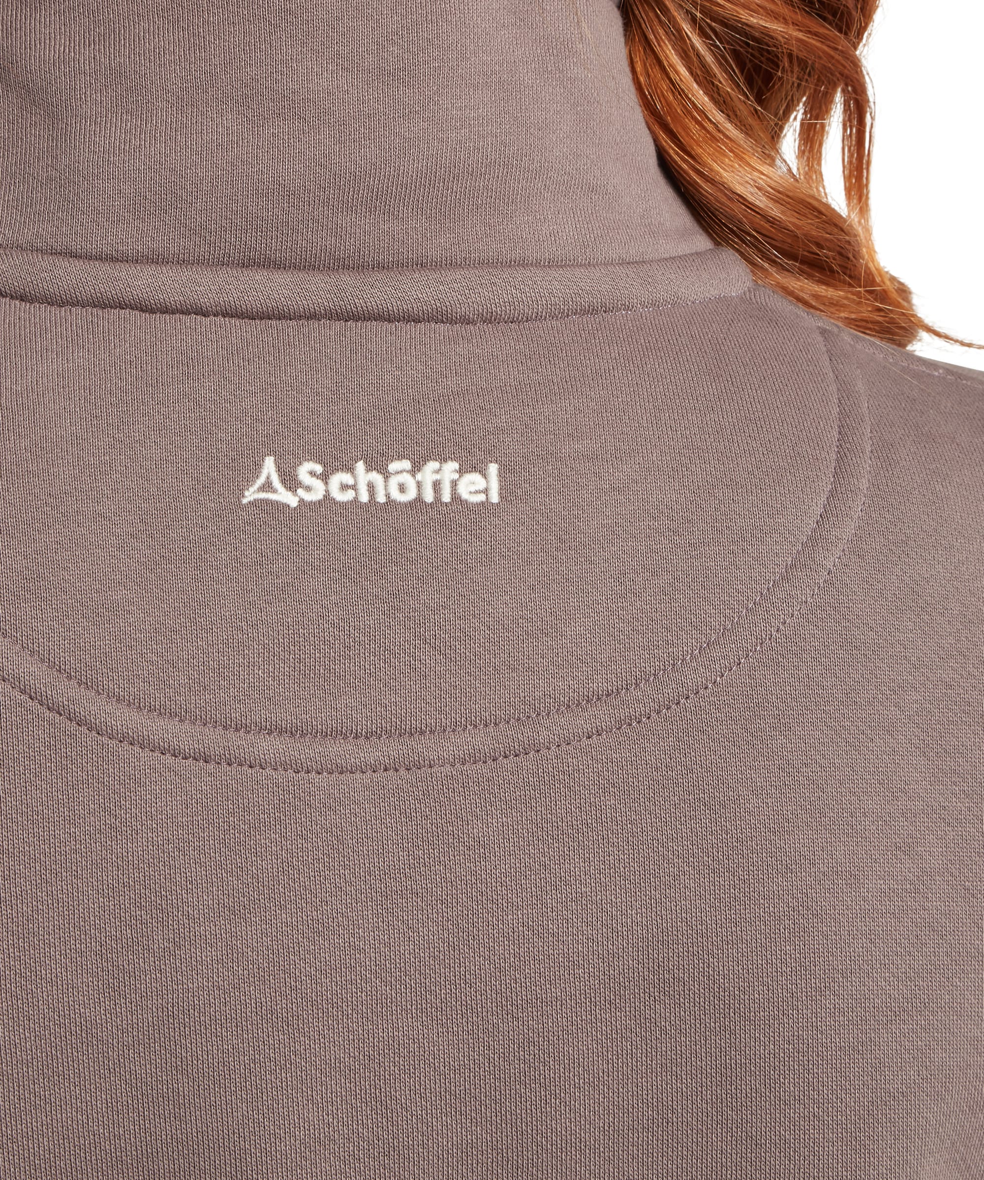 Rear neck close-up of the Schöffel Women's St Agnes Sweatshirt in taupe brown, highlighting the raised stand collar, smooth jersey fabric, curved back yoke seam, and tonal white Schöffel embroidered logo at the upper back