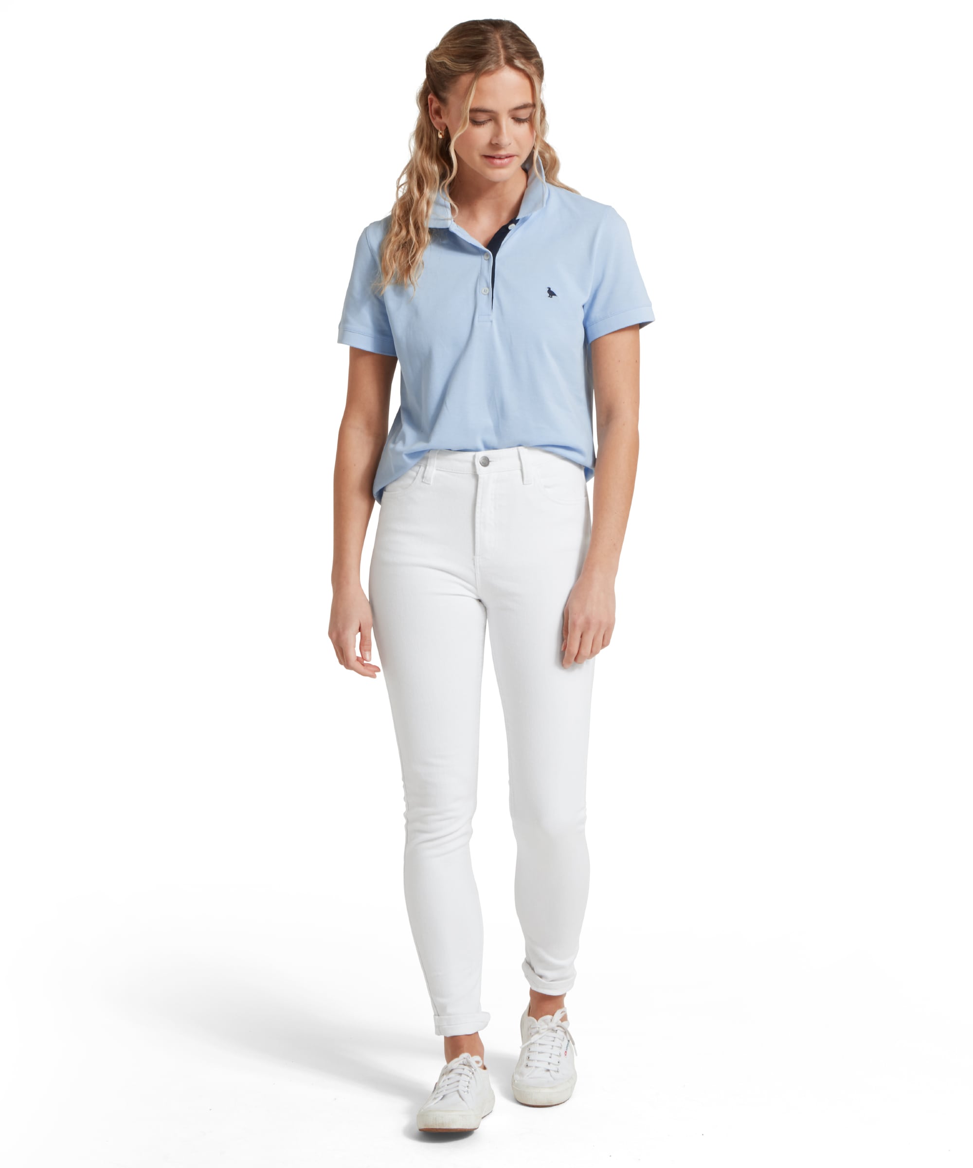 Schöffel Women's St Ives Polo Shirt in pale blue, full-length view on model paired with white jeans and trainers