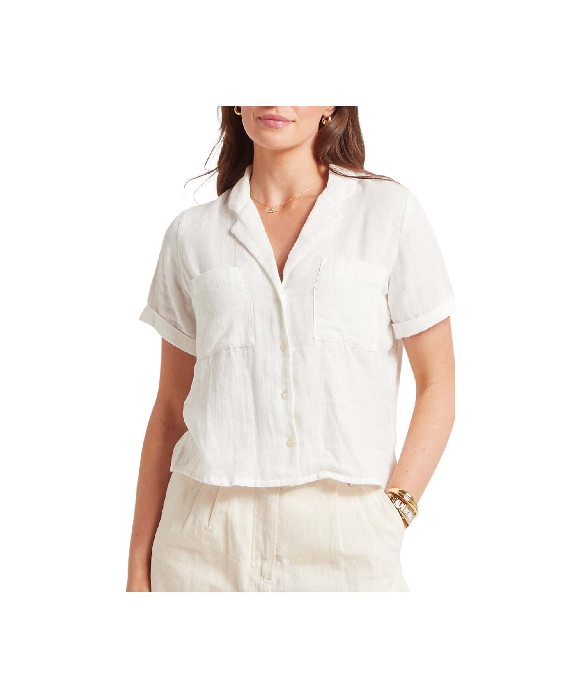 Woman wearing a white short-sleeve blouse on a white background