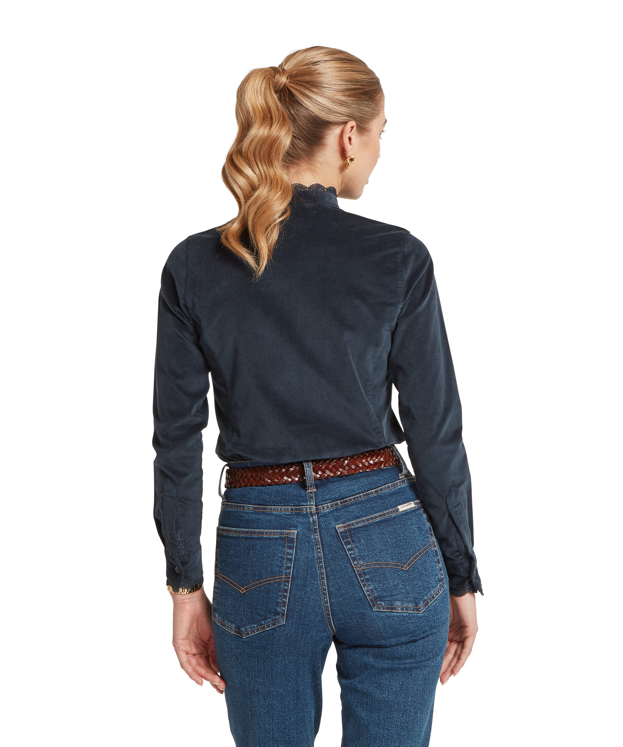 Rear view of the Women's Schöffel Thetford Cord Shirt in navy cord, highlighting the clean back seaming, lace-trimmed collar and button cuff detailing, worn with blue jeans and a tan plaited belt.