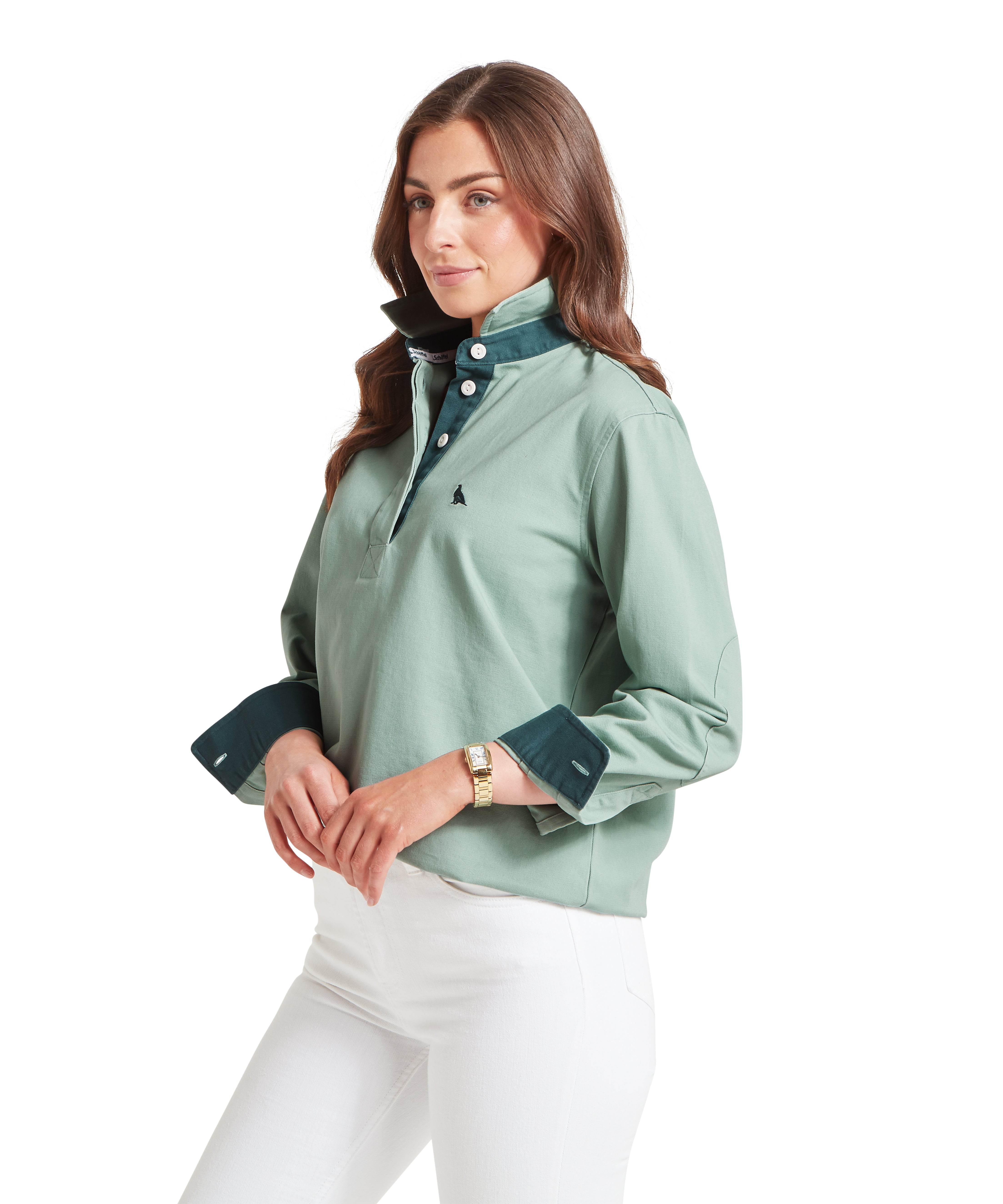 Woman wearing a light green shirt with dark green accents on a white background