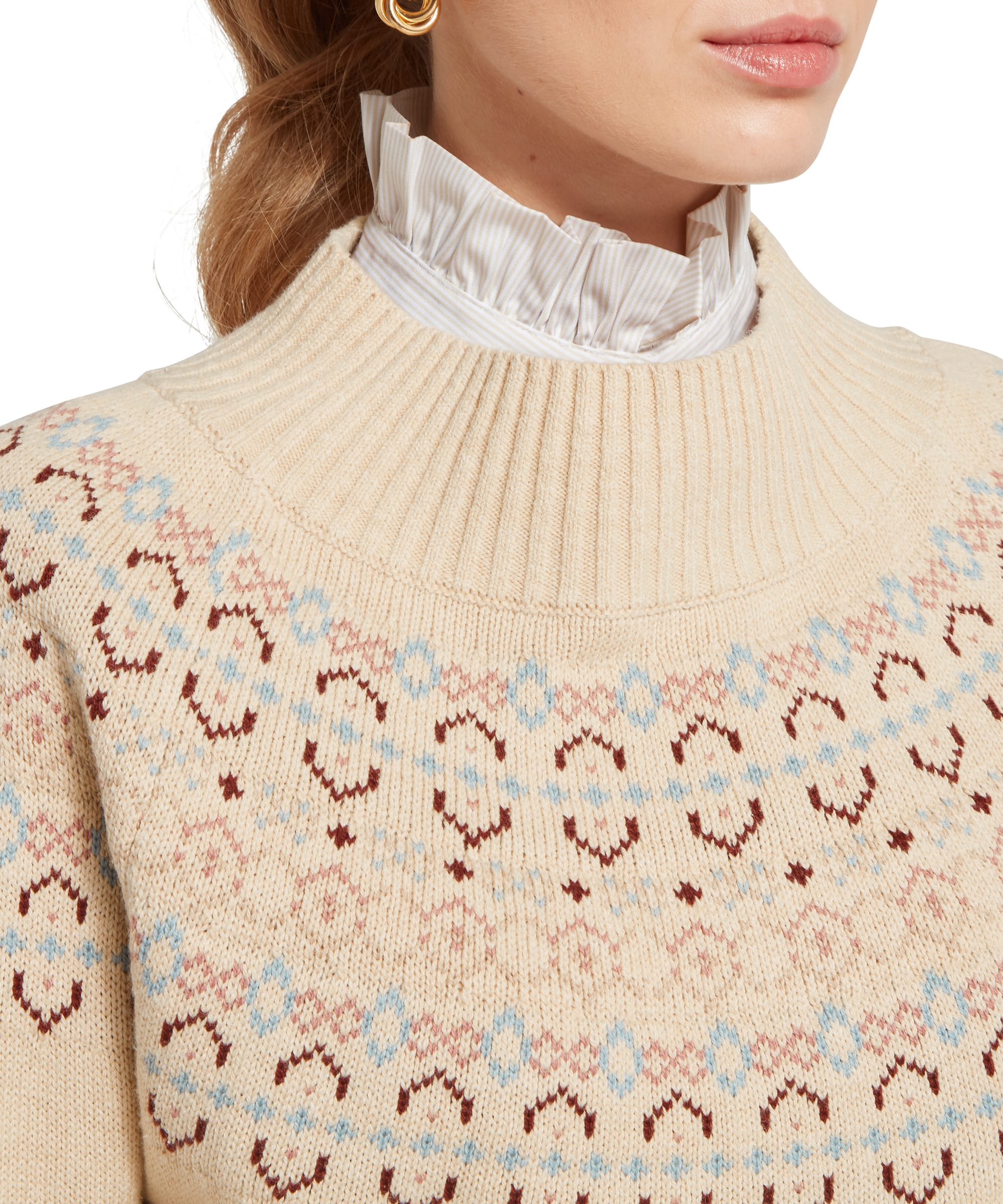 Close-up detail of the Schöffel Women's Tresness Fair Isle Jumper neckline, showing the intricate fairisle knit pattern in cream, dusty blue, blush pink and burgundy, with a ribbed funnel neck and white frill-collar blouse beneath